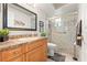 Updated bathroom with a vanity, framed mirror, and walk-in shower for a modern and functional design at 2310 Augusta Dr, Spring Hill, FL 34606