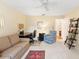 Bright bedroom features a comfortable couch, desk, and cozy armchair at 2310 Augusta Dr, Spring Hill, FL 34606