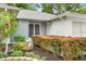 Inviting front entrance with beautiful landscaping and double doors at 2310 Augusta Dr, Spring Hill, FL 34606