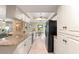 The kitchen features granite countertops, stainless steel appliances, and an open layout to the dining room at 2310 Augusta Dr, Spring Hill, FL 34606