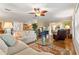 Inviting living room with hardwood floors and comfortable seating, perfect for relaxing and entertaining guests at 2310 Augusta Dr, Spring Hill, FL 34606
