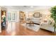 Open-concept living room bathed in natural light, seamlessly connecting to the entryway at 2310 Augusta Dr, Spring Hill, FL 34606