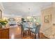 Spacious living room with hardwood floors and large windows that provide plenty of natural light throughout the space at 2310 Augusta Dr, Spring Hill, FL 34606