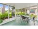 Relaxing screened patio with comfortable seating and views of the lush backyard at 2310 Augusta Dr, Spring Hill, FL 34606