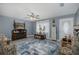 Cozy living room featuring stylish decor, ceiling fan, and light gray colored walls at 27263 Warner Ave, Brooksville, FL 34602