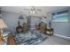 Open-concept living room with modern flooring and gray colored walls leading to dining area at 27263 Warner Ave, Brooksville, FL 34602