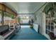 Enclosed back patio features spacious seating and a view to backyard at 27263 Warner Ave, Brooksville, FL 34602