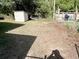 Backyard featuring a shed and lawn area, offering practical outdoor space and storage at 300 Midwood Dr, Plant City, FL 33566