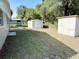 Spacious backyard with two storage sheds, providing ample outdoor storage solutions at 300 Midwood Dr, Plant City, FL 33566