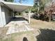 Backyard patio and lawn area, with room for seating, and outdoor activities at 300 Midwood Dr, Plant City, FL 33566