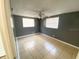 Bright bedroom featuring tile floors and dual windows with blinds at 300 Midwood Dr, Plant City, FL 33566