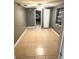 A bedroom with a view of a doorway, neutral walls, tile flooring, and a ceiling fan at 300 Midwood Dr, Plant City, FL 33566