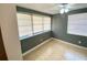 Bedroom featuring tile floors and dual windows with blinds at 300 Midwood Dr, Plant City, FL 33566