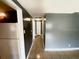 Hallway with tile flooring and neutral colored walls at 300 Midwood Dr, Plant City, FL 33566