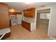 Traditional kitchen with wood cabinets, white appliances, and tile flooring at 300 Midwood Dr, Plant City, FL 33566