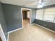 Living room with tile flooring, ceiling fan, neutral walls and natural light, creating a comfortable and bright atmosphere at 300 Midwood Dr, Plant City, FL 33566