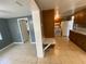 Open-concept room with tile flooring adjacent to kitchen at 300 Midwood Dr, Plant City, FL 33566