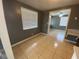Open-concept room with tile flooring flowing into bedroom at 300 Midwood Dr, Plant City, FL 33566