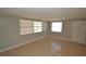 Cozy living room featuring neutral walls, tile flooring, and natural light from windows at 300 Midwood Dr, Plant City, FL 33566