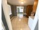 Open-concept room with tile flooring flowing into kitchen and bedroom at 300 Midwood Dr, Plant City, FL 33566
