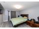 Serene bedroom featuring neutral tones, a cozy bed, and soft curtains at 3140 Jackson Dr, Holiday, FL 34691