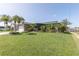 Sprawling front yard with mature trees and landscaping provides great curb appeal at 3140 Jackson Dr, Holiday, FL 34691