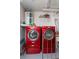 Laundry room with bright red washer and dryer units at 3140 Jackson Dr, Holiday, FL 34691