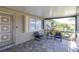 Screened in porch includes patio furniture and tile flooring at 3140 Jackson Dr, Holiday, FL 34691