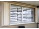 Large window with privacy blinds and hurricane shutters at 3140 Jackson Dr, Holiday, FL 34691