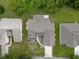Aerial view showcases the property's layout with a well-maintained lawn and surrounding trees at 35046 Smoketree Ln, Dade City, FL 33523
