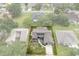 Aerial view showcases the property and its boundaries within a well-maintained neighborhood at 35046 Smoketree Ln, Dade City, FL 33523