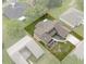 Aerial view showcases the property boundaries, landscaped yard, and neighborhood surroundings at 35046 Smoketree Ln, Dade City, FL 33523