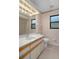 Bathroom featuring traditional fixtures and a shower at 35046 Smoketree Ln, Dade City, FL 33523