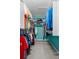 This closet features a full size closet and shelving with custom organized storage and teal walls at 35046 Smoketree Ln, Dade City, FL 33523