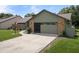 A well-maintained two-car garage and driveway provide ample parking space at 35046 Smoketree Ln, Dade City, FL 33523