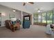 Inviting living room featuring large windows, comfortable seating and ample space for relaxing at 35046 Smoketree Ln, Dade City, FL 33523