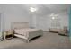 Spacious bedroom featuring neutral carpet, bright natural light, and generous closet space at 35046 Smoketree Ln, Dade City, FL 33523
