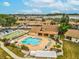 Relax by the sparkling community pool with shuffleboard courts, lounge chairs, and meticulously maintained grounds at 3832 Sailmaker Ln # 3832, Holiday, FL 34691