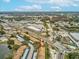 An aerial view revealing the property's access to a well-connected road and nearby commercial area at 3832 Sailmaker Ln # 3832, Holiday, FL 34691