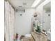 Well-lit bathroom featuring granite vanity, a shower/tub and nautical decorations at 3832 Sailmaker Ln # 3832, Holiday, FL 34691
