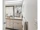 Neat bathroom featuring a granite vanity and a shower/tub combo with decorative shower curtain at 3832 Sailmaker Ln # 3832, Holiday, FL 34691