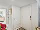 Welcoming entryway with tile flooring and white doors, offering a glimpse into the home's interior at 3832 Sailmaker Ln # 3832, Holiday, FL 34691