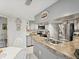Bright kitchen featuring gray cabinets, granite countertops, and stainless-steel appliances at 3832 Sailmaker Ln # 3832, Holiday, FL 34691