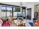 Comfortable living room featuring large windows, neutral walls, and tile flooring at 3832 Sailmaker Ln # 3832, Holiday, FL 34691