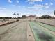 Enjoy the shuffleboard courts with the pool and palm trees in the background at 3832 Sailmaker Ln # 3832, Holiday, FL 34691