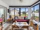 Bright sun room with tile flooring, ceiling fan and expansive windows at 3832 Sailmaker Ln # 3832, Holiday, FL 34691