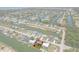 Aerial view of a waterfront property showcasing the canal front living and layout of the neighborhood at 4048 Bluefish Dr, Hernando Beach, FL 34607