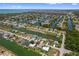 High-angle view of canal-lined homes in a coastal neighborhood, perfect for boating and water activities at 4048 Bluefish Dr, Hernando Beach, FL 34607