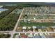 Expansive aerial shot of the neighborhood, featuring canals, waterfront homes, and lush landscapes at 4048 Bluefish Dr, Hernando Beach, FL 34607