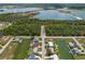 Panoramic aerial view of the neighborhood with canals and lakes in a serene, wooded setting at 4048 Bluefish Dr, Hernando Beach, FL 34607